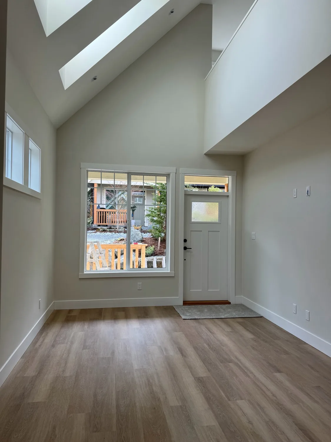 Light-filled vaulted room with freshly finished pale walls